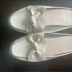 Kate spade size 7.5 light pink slip ons with bow on the front.